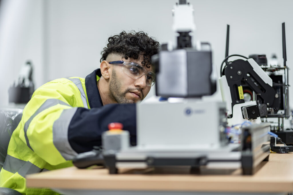 Team man of engineers practicing maintenance Taking care and practicing maintenance of old machines in the factory so that they can be used continuously.